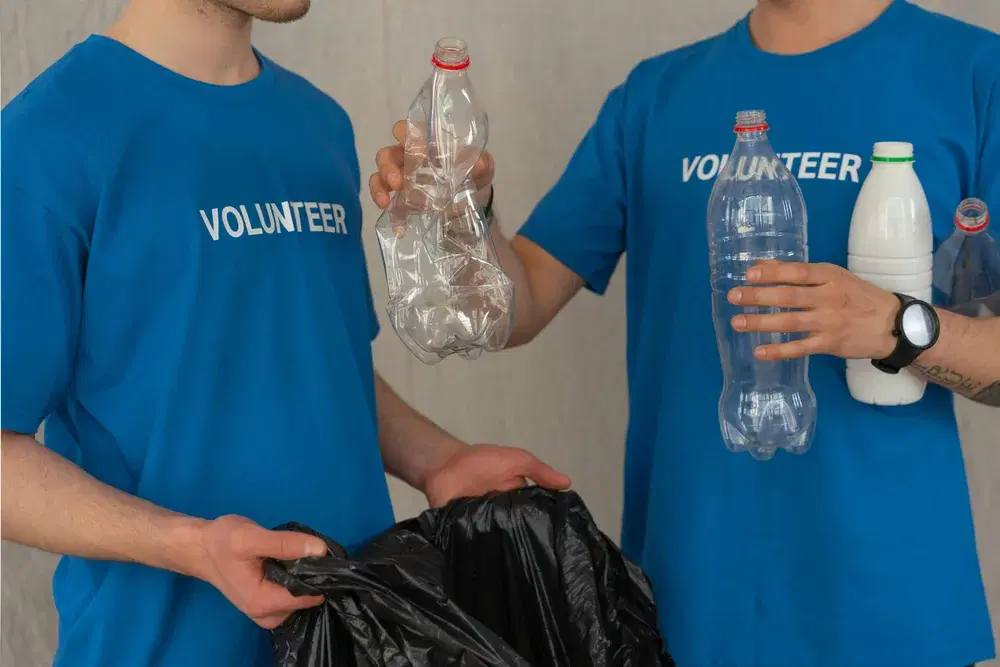 Volunteers collecting plastic bottles